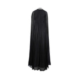Back view of the Marwa Ghassan gown showcasing the pleated, flowing sheer cape and the detailed crystal and pearl embellishment on the high-neck collar.