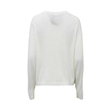 Max Mara long-sleeve virgin wool sweater featuring a black abstract floral or ink-blot graphic on the upper left chest.