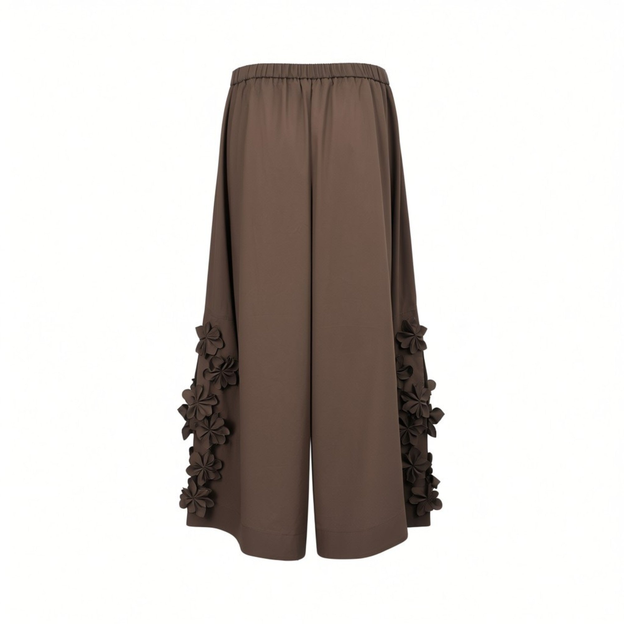 Rear view of Meimeij brown wide-leg trousers highlighting the gathered elasticated back waistband and the vertical arrangement of 3D floral appliqués on the lower legs against a white background.