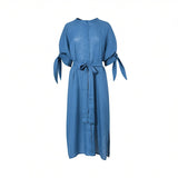 Front view of a cornflower blue Meimeij midi dress showcasing a band collar, matching fabric waist belt tied in a bow, and half-sleeves with distinct self-tie details against a white background.