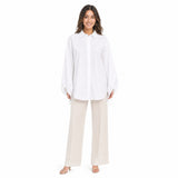 Full-length front view of a model wearing the Meimeij oversized white button-down shirt paired with tailored beige wide-leg trousers from BLUE SALON shop.