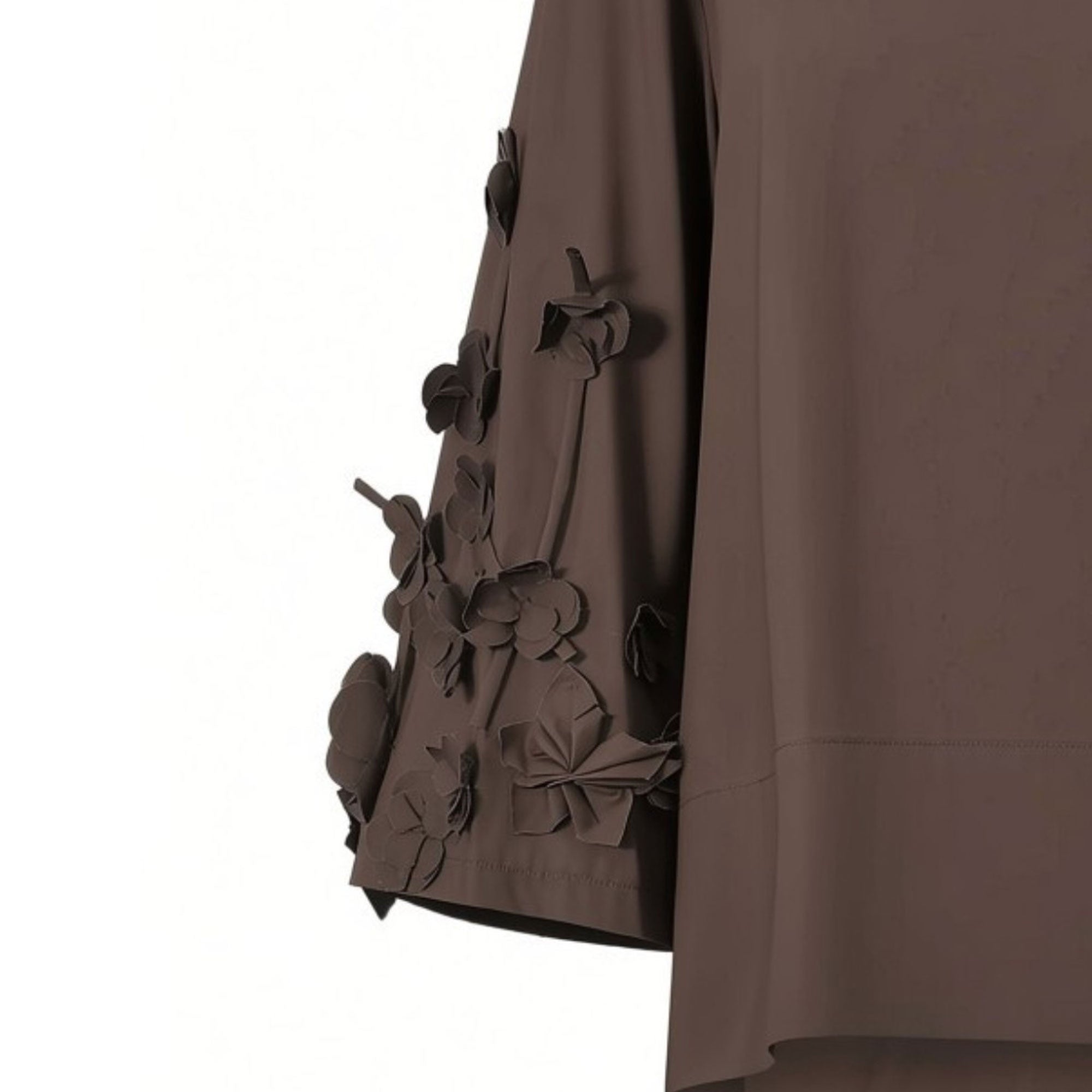 Close-up detail shot of the Meimeij dark brown blouse sleeve highlighting the intricate craftsmanship of the three-dimensional fabric floral elements from BLUE SALON shop.