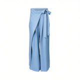 Three-quarter front view of Meimeij light blue wide-leg trousers showcasing a unique asymmetric front wrap panel tied into a delicate side bow at the waist against a white background.