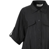 Close-up shot of the Meimeij black blouse detailing the pointed collar, tonal buttons, utility pocket flap, and sleeve button-tab from BLUE SALON shop.