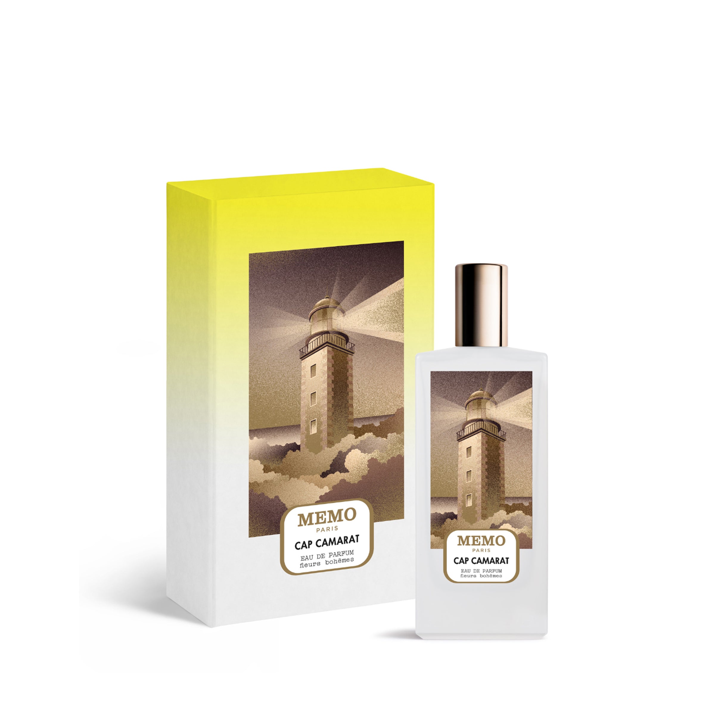 A luxury perfume set featuring the Memo Paris Cap Camarat Eau de Parfum bottle and its presentation box. The rectangular frosted white bottle has a gold cap and a central illustration of a lighthouse shining its light over rocky waves. The box matches the artwork with a vibrant yellow-to-white gradient background, emphasizing the premium "Fleurs Bohèmes" collection branding.