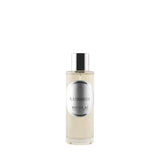 A matte glass bottle of Memo Paris Palais Bourbon featuring a golden neoclassical illustration of three figures.