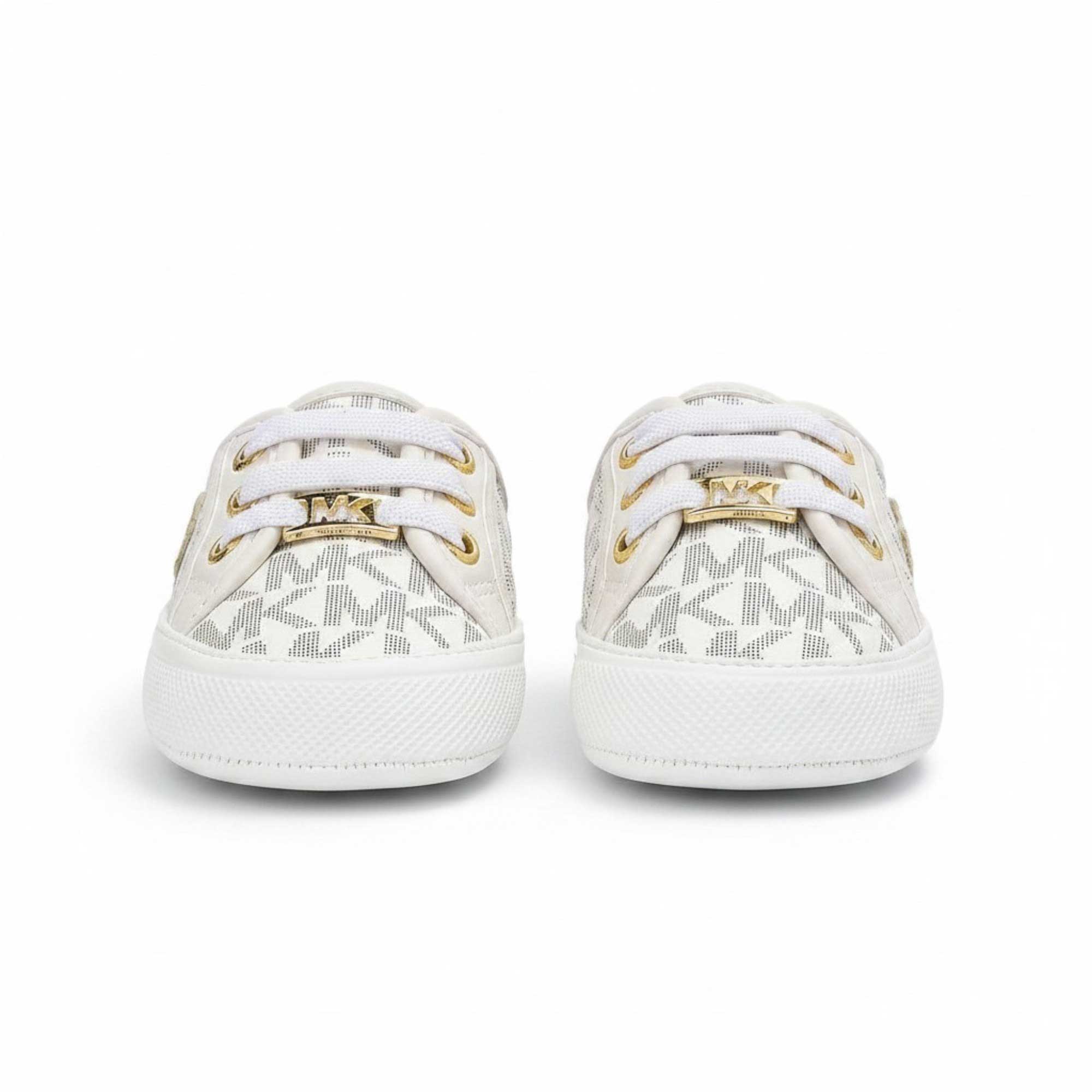 Directly overhead bird's-eye view of a pair of infant Michael Kors slip-on shoes, showing the tan interior lining with gold printed branding and white elastic laces.