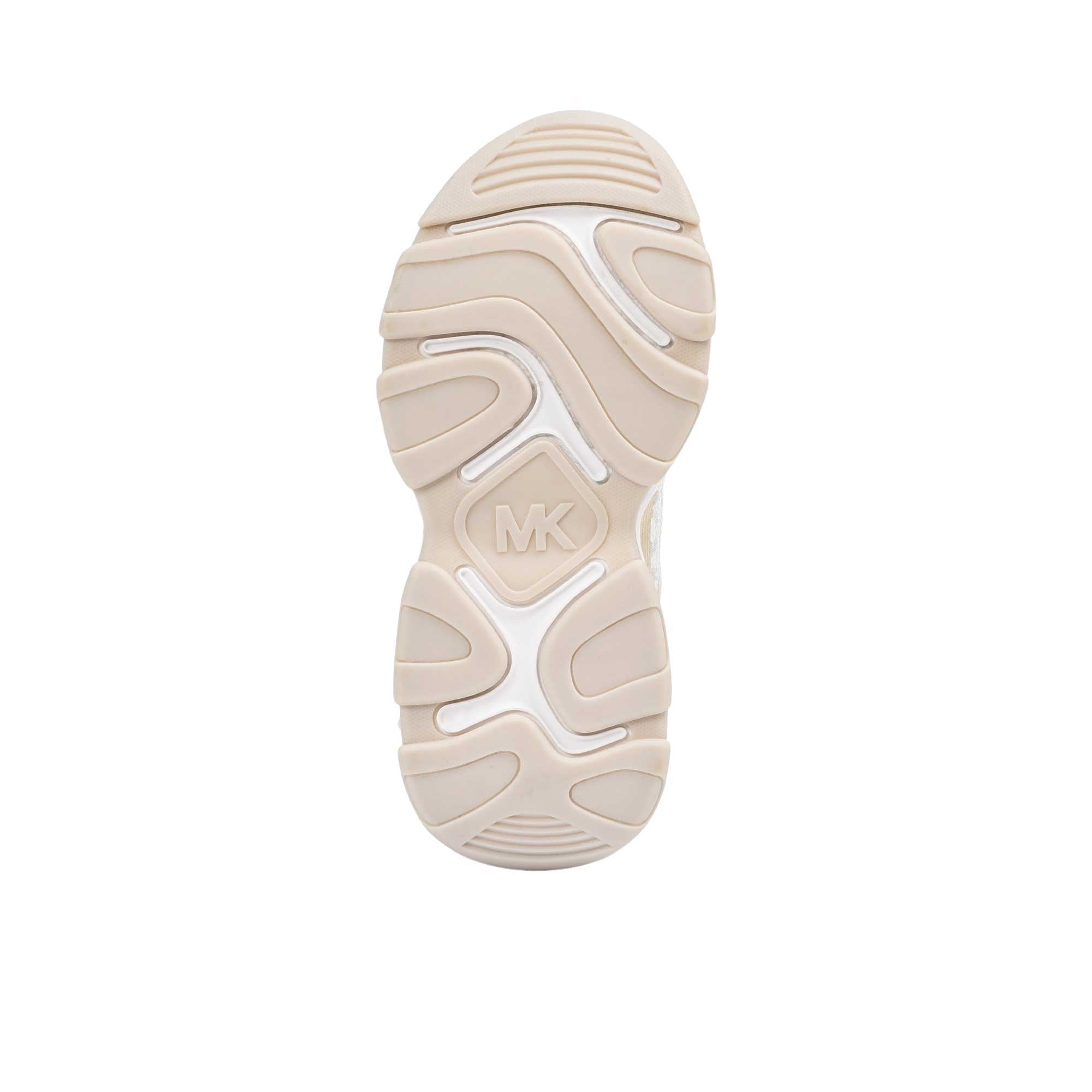 Underneath view of the white rubber outsole of a kids' Michael Kors sneaker, showcasing a flat textured tread pattern and a large molded circular MK logo in the center.