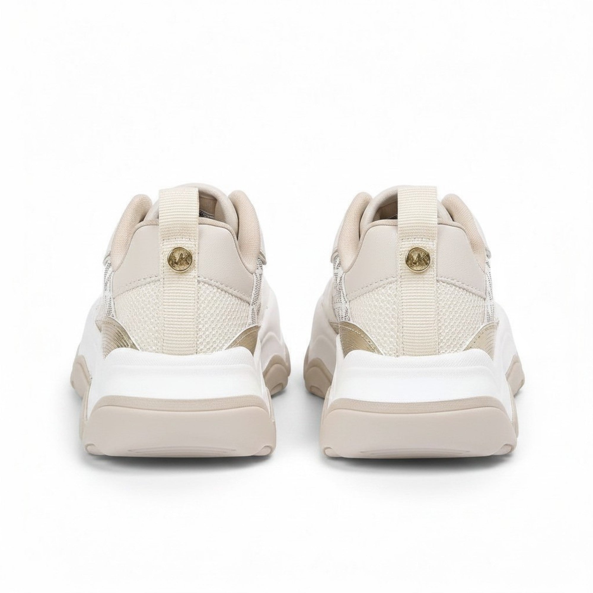 Rear heel view of a pair of kids' off-white trainers, showcasing smooth faux-leather back panels topped with shiny, metallic gold heel tabs embossed with Michael Kors text.