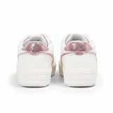 Rear heel view of a pair of white Michael Kors platform sneakers showing a shiny, metallic pink reptile-textured heel tab and repeating embossed MK logos on the clean white platform midsole.