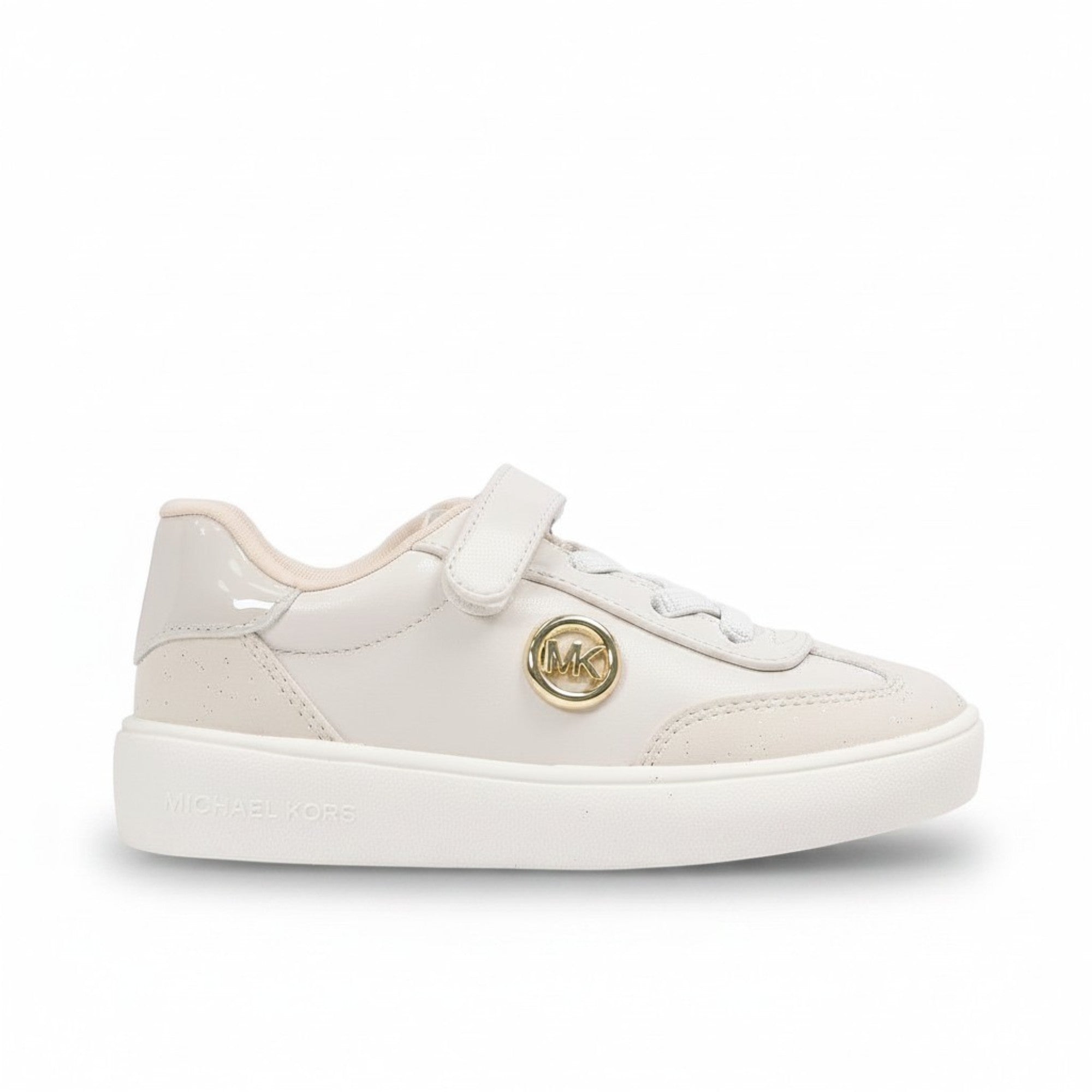 Side profile view of a kids' white Michael Kors sneaker showcasing a sculpted athletic midsole, soft grey and light pink panel overlays, and printed brand lettering.
