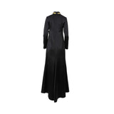 Back view of the black Mijade Fashion gown showing a sleek, structured fit and a gold-trimmed high collar.