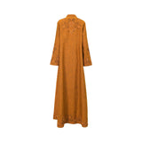 Back view of a Mijade Fashion ocher linen gown showing a decorative embroidered yoke on the upper back and a matching embroidered border along the bottom hem.