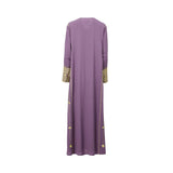 Back view of a floor-length lavender purple kaftan by Mijade Fashion showing a clean silhouette with gold embroidery accents on the side seams and sleeves.