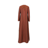 Back view of a Mijade Fashion rust linen gown showing a decorative embroidered yoke on the upper back and clean, elegant lines extending to the floor.