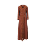 Front view of a Mijade Fashion floor-length rust-colored linen kaftan featuring intricate tonal embroidery and beadwork along the neckline, chest, and sleeves with a braided center trim.