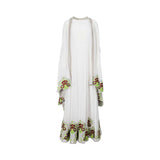 A front view of a Mijade Fashion two-piece white kaftan set featuring a floor-length dress and a matching cape with red and green floral embroidery on the hems.