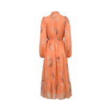 Back studio shot of the orange Milva Mi floral print maxi dress, highlighting its clean elasticated waistline and gathered tiered hem.