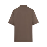 Back studio shot of the brown Milva Mi short-sleeve blouse shown without the belt, highlighting the clean, boxy tailoring and structured cuffs.