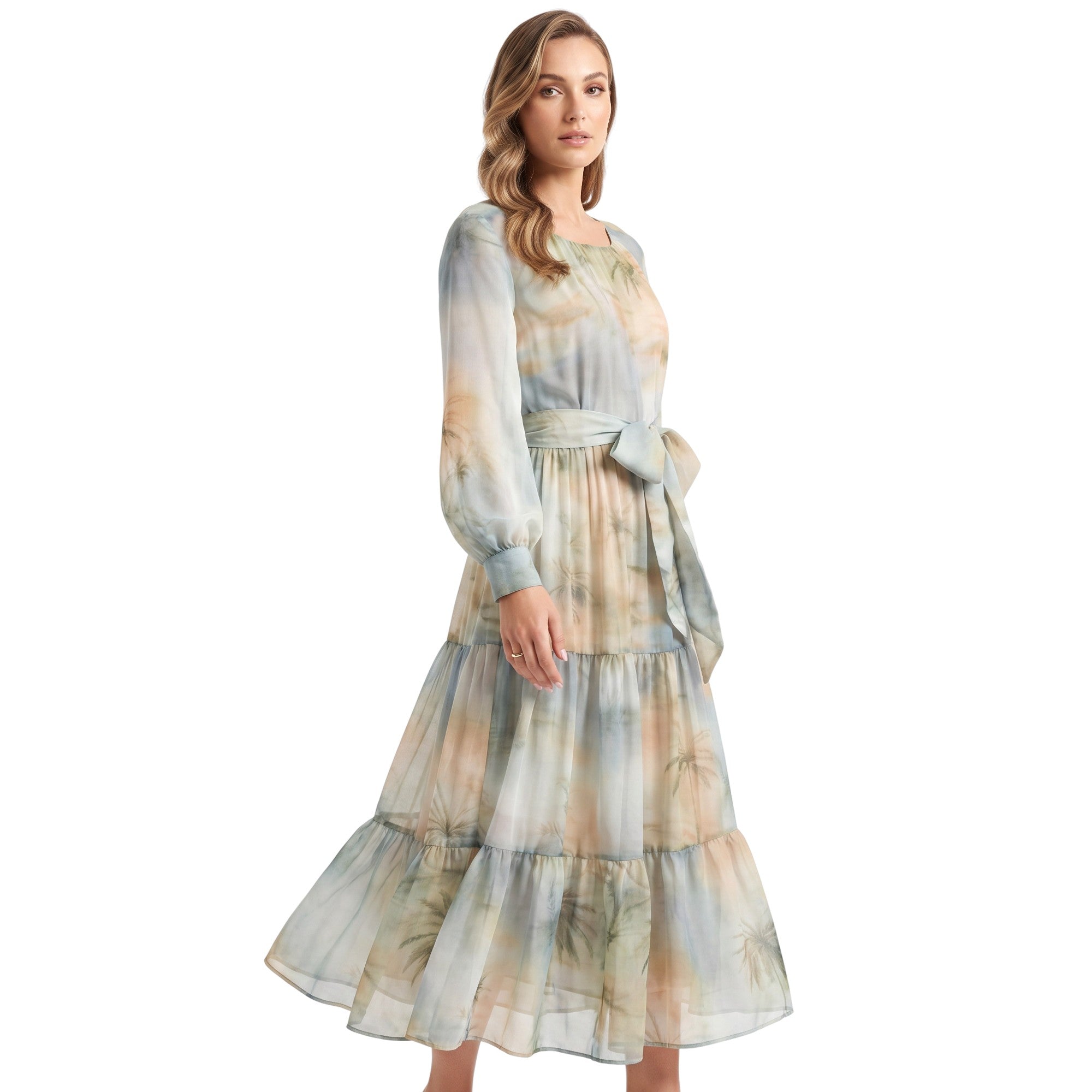 Studio shot of a model wearing the Milva Mi tropical print tiered chiffon dress, highlighting its fluid movement and elegant long blouson sleeves.