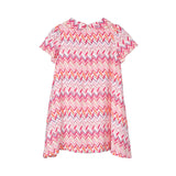 Back view of the pink Missoni baby dress, highlighting the continuous chevron print and a clean, concealed central zipper closure.