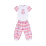 Front full-length layout of the Missoni baby girl set, showing a white short-sleeved teddy bear tee alongside matching pink and orange zigzag pants with white cuffs.