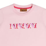 Close-up detailed shot of the Missoni pink T-shirt neckline, showing the brown branded inner label and the pink, purple, and red patterned zigzag logo text print.