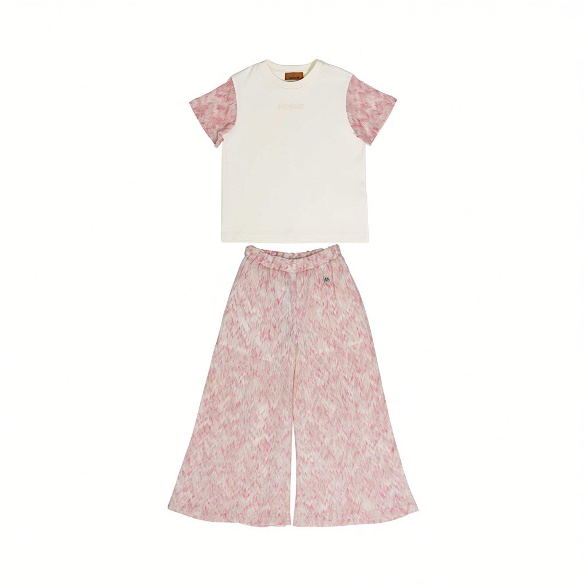 Front full view of a Missoni kids two-piece set featuring an off-white T-shirt with pink zigzag knit sleeves and matching abstract pink wide-leg trousers.