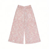 Back view of the Missoni kids relaxed trousers, emphasizing the comfortable elastic waistband and the continuous abstract pink chevron motif.