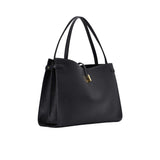 Perspective view of the Mlouye Naomi bag from the left, highlighting the structured side gussets and slim double shoulder straps.
