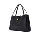 Right perspective view of the black leather Mlouye bag, showing the side strap detail and the depth of the tote’s architectural silhouette.