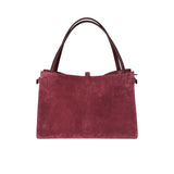Maroon handbag with brown handles on a white background