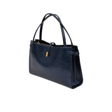 Navy handbag on a white background.