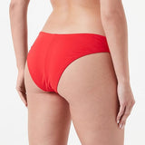 Model back view of the Triumph Flex Smart Summer red Brazilian bikini bottoms, highlighting the cheeky cut and seamless, vibrant fabric. Available for Online Purchase
