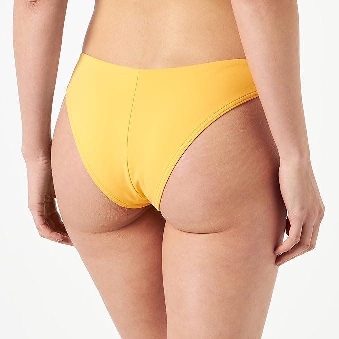 Model back view of the Triumph Flex Smart Summer saffron yellow Brazilian bikini bottoms, highlighting the high-leg cut and seamless edges. Available Online