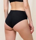 Model back view of the Triumph Flex Smart black maxi panty, highlighting the high-waisted coverage and smooth, seamless fabric. Available Online at Blue Salon Qatar