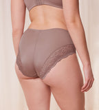 Model back view of the Triumph Ladyform Soft light brown maxi panty, showing the high-waisted cut and delicate lace side panels. Shop Online Today