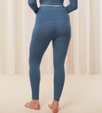 Model back view of the Triumph Natural Spotlight blue rib comfort stretch trousers, highlighting the pregnancy-friendly waistband and wide-leg cut. Shop Online