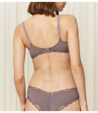 Model back view of the Triumph Natural Spotlight grey maternity bra, showing the adjustable straps and back closure. Available Online Now