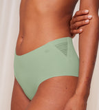 Model close-up side view of the Triumph Flex Smart green maxi panty, highlighting the high-waisted silhouette and smooth, vibrant stretch fabric. Shop Online Now