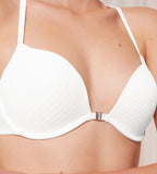 Model close-up view of the Triumph Harmony Spotlight white push-up bra, showing the intricate graphic lace and the front-opening clasp. Shop Online Today