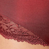 Model close-up view of the Triumph Ladyform Soft red maxi panty, highlighting the decorative lace inserts. Available for Online Purchase