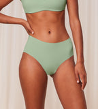 Model font view of the Triumph Flex Smart green maxi panty, highlighting the high-waisted silhouette and smooth, vibrant stretch fabric. Shop Online Now