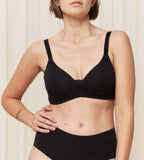 Model front view of the Triumph Fit Smart black non-wired bra, showcasing the stretch lace and seamless comfort design. Shop the Latest Online