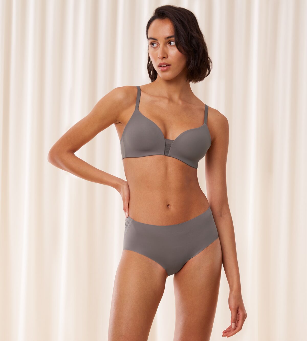 Model full font view of the Triumph Flex Smart Grey maxi panty, highlighting the high-waisted fit and smooth, seamless construction. Find Online Today