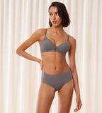 Model full font view of the Triumph Flex Smart Grey maxi panty, highlighting the high-waisted fit and smooth, seamless construction. Find Online Today