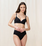 Model full front view of the Triumph Fit Smart black non-wired bra, showcasing the stretch lace and seamless comfort design. Shop the Latest Online