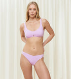 Model full front view of the Triumph Flex Smart Summer light purple padded bikini top, showcasing the smooth neckline and flexible wire-free construction. Shop the Latest Online