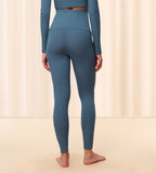Model second back view of the Triumph Natural Spotlight blue rib comfort stretch trousers, highlighting the pregnancy-friendly waistband and wide-leg cut. Shop Online