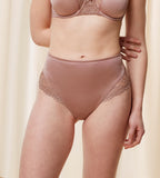 Model second front view of the Triumph Ladyform Soft light brown maxi panty, showing the high-waisted cut and delicate lace side panels. Shop Online Today